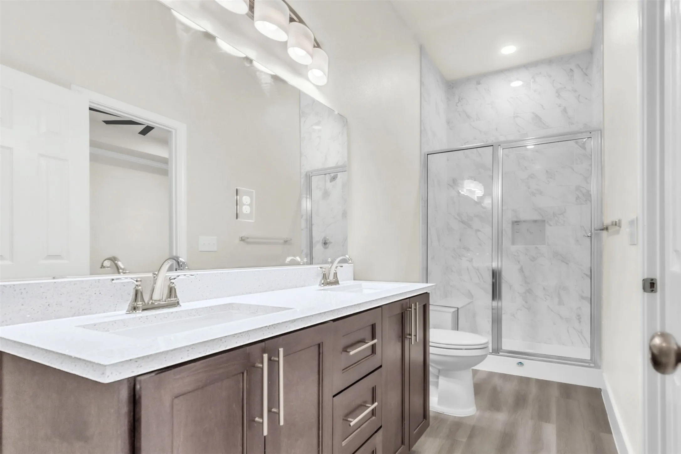 Primary bath features stunning quartz double vanity