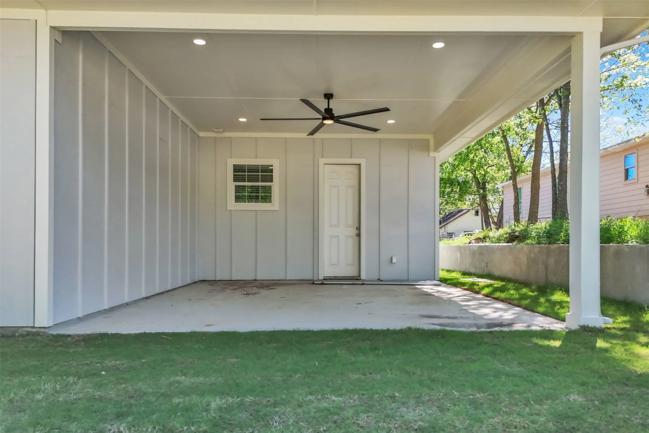 Grand oversized patio with tall ceiling and resort fan