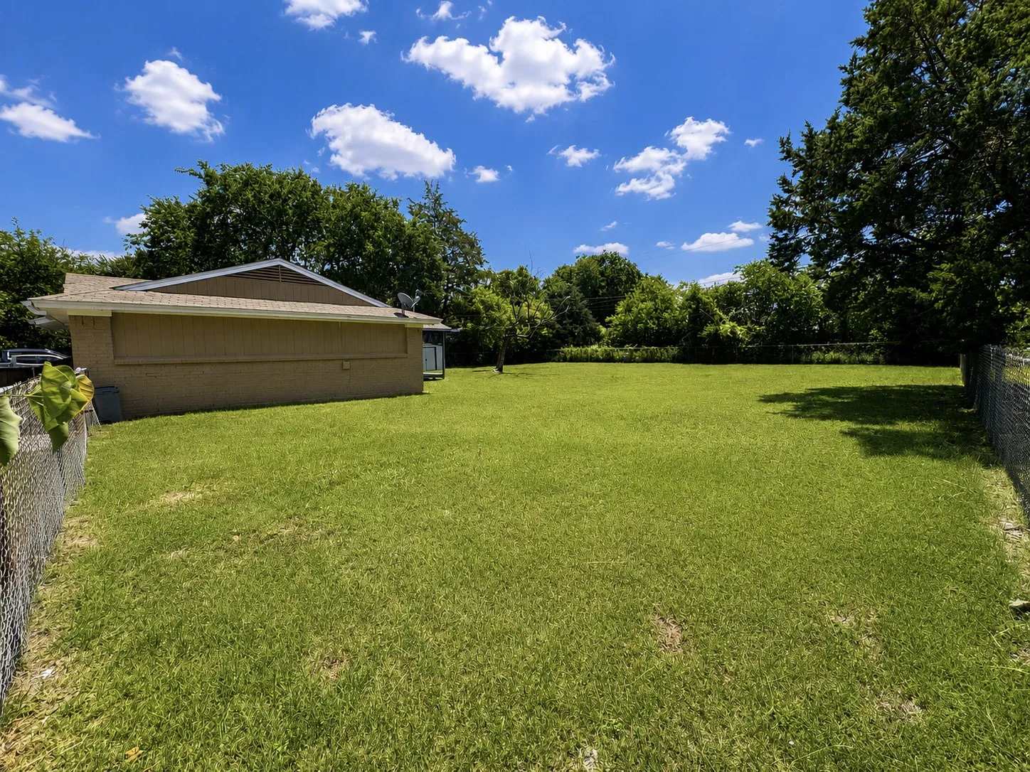 Expansive green lawn providing ample outdoor space