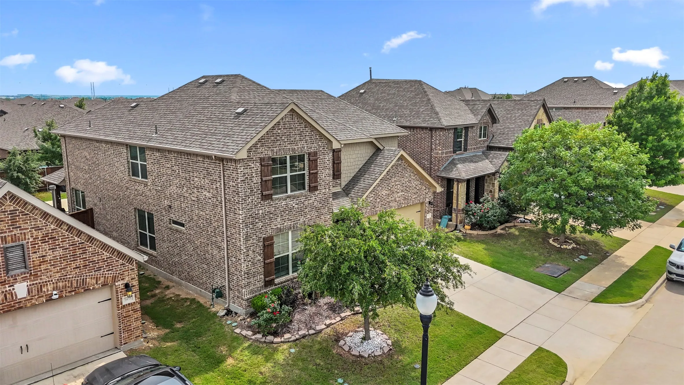 Brick veneer exterior with a two-story design and a covered entry
