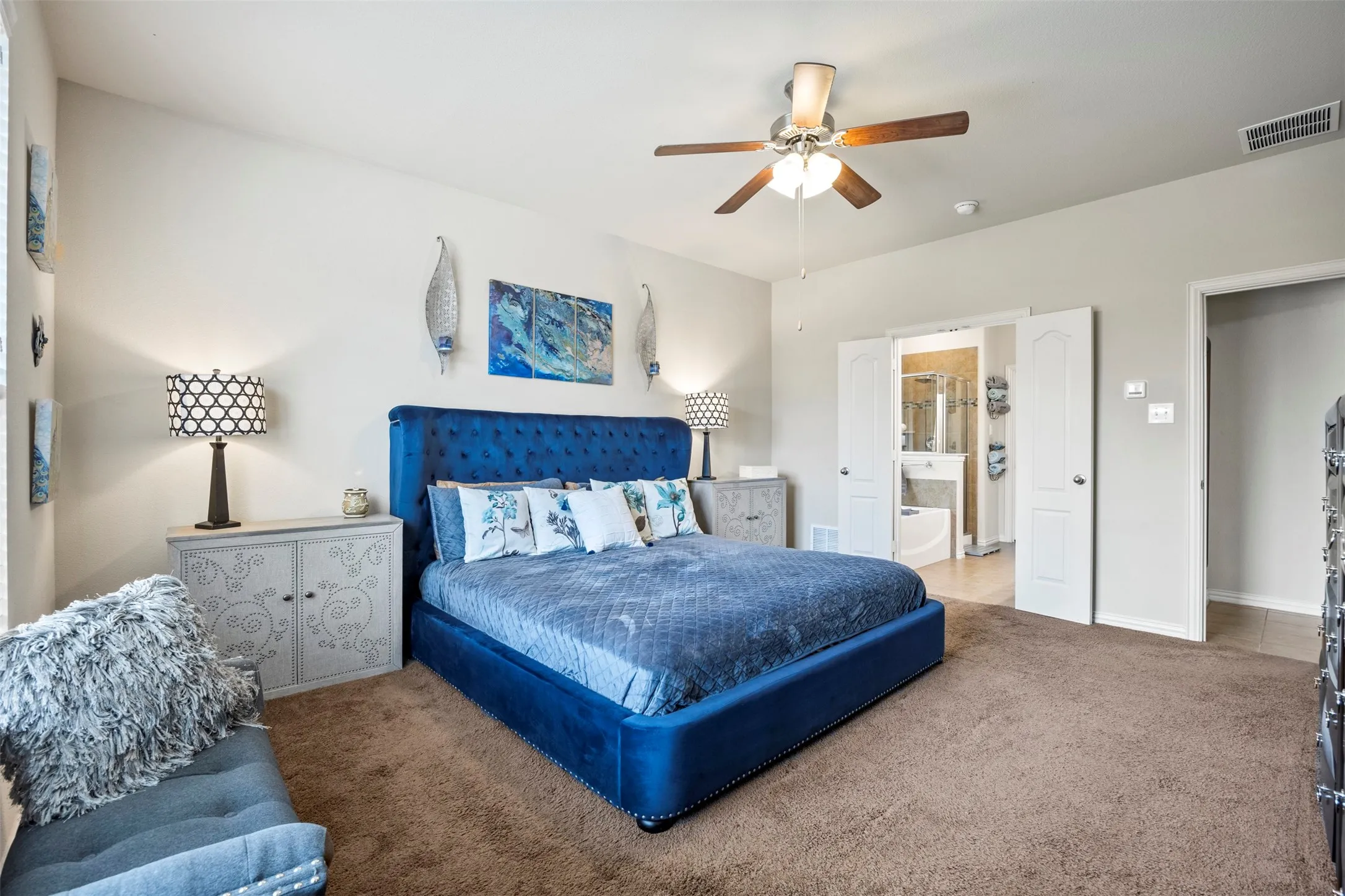 Spacious interior with carpet flooring and vaulted ceilings