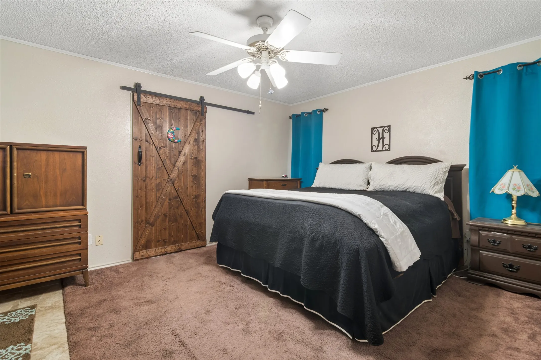 Primary bedroom, custom barn door to ensuite bathroom