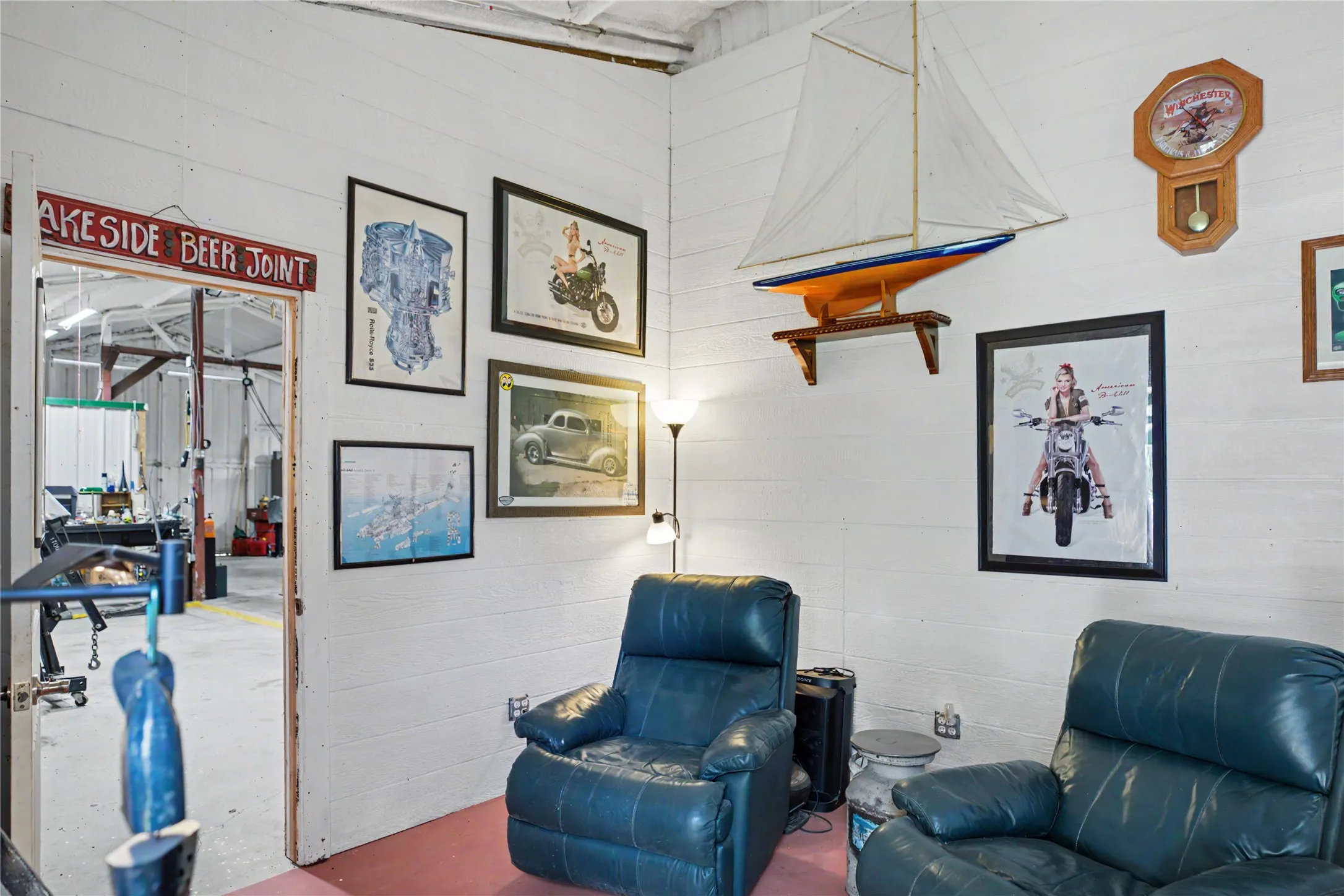 White paneled walls define this interior space, featuring a doorway to an adjacent area