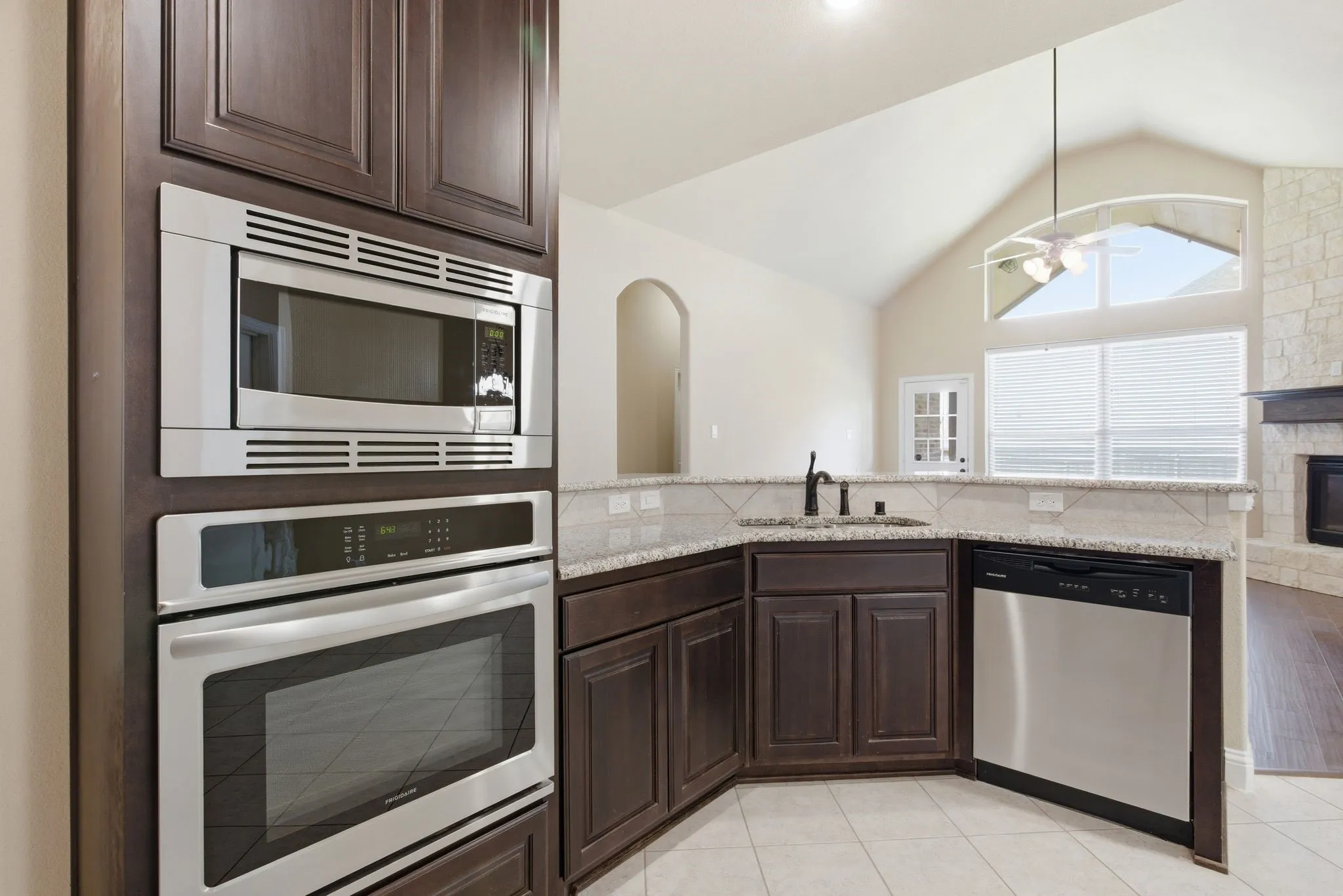 Large kitchen with granite and stainless steel.