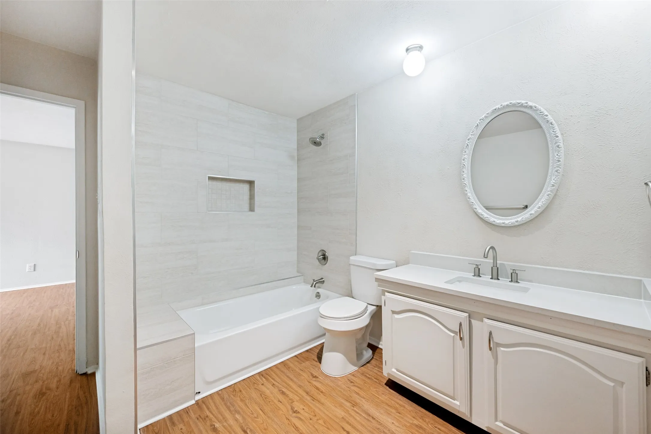 This hall bathroom serves 2 bedrooms one of which has access to this oversized Hall Bathroom.