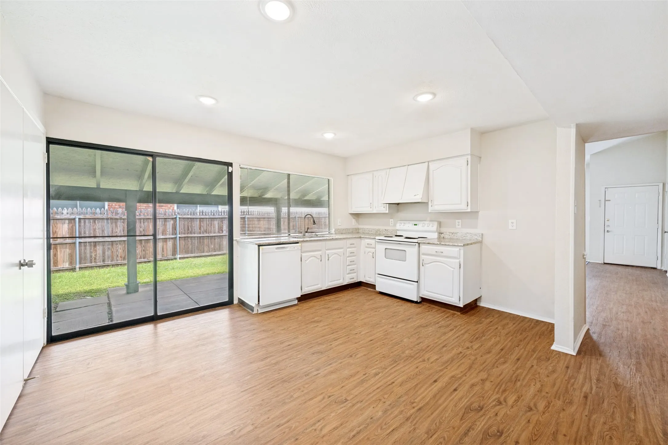 Granite countertops grace the kitchen cabinets.
