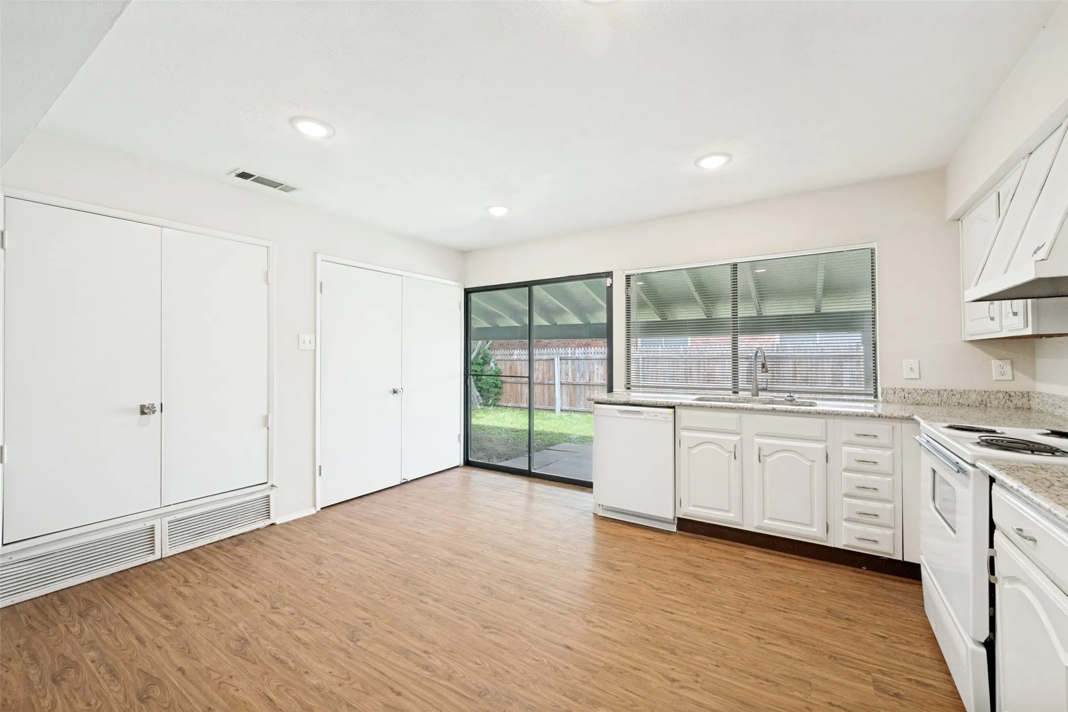 The kitchen has a door that leads to the patio and the laundry closet.