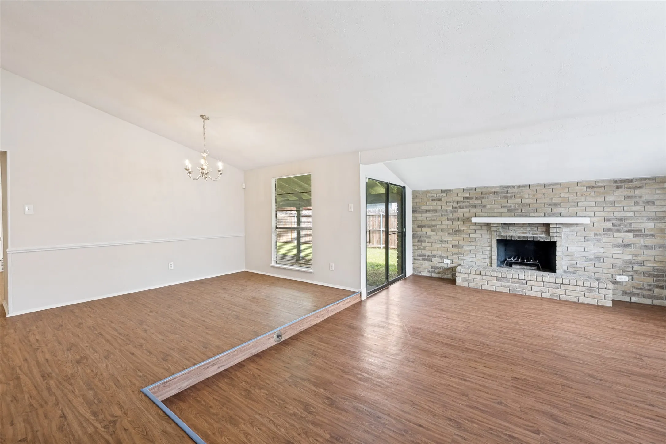 The entry provides a view of the woodburning fireplace.