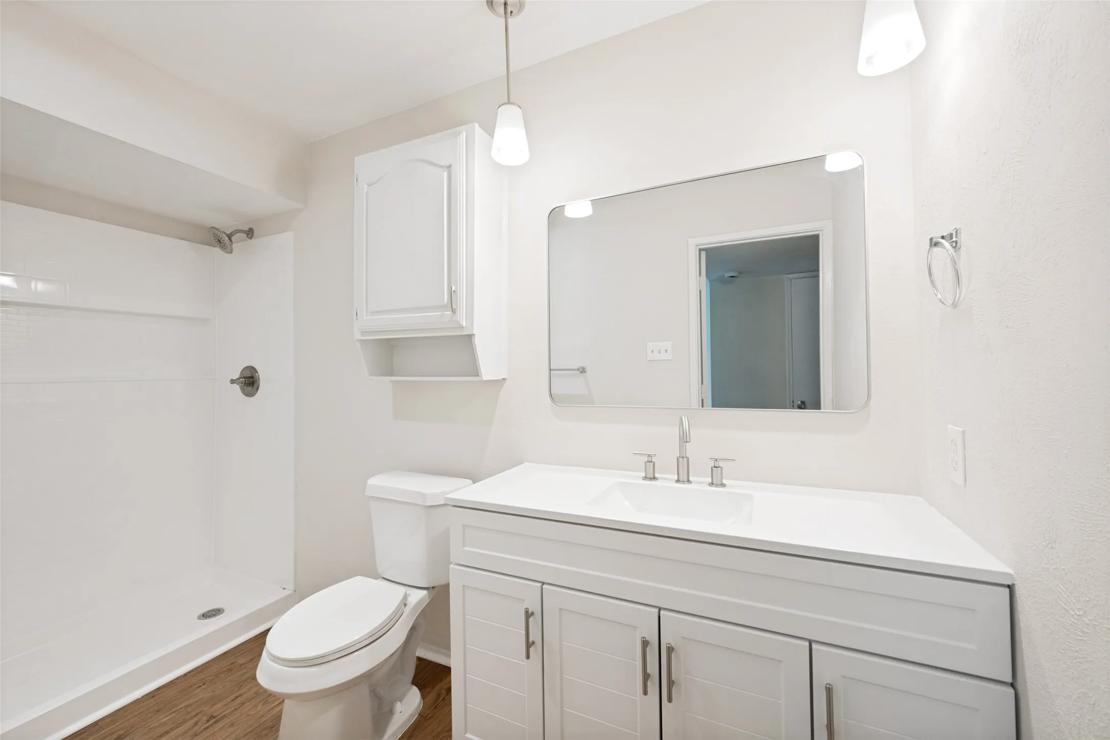 The hard surface vanity shines in the master bathroom.
