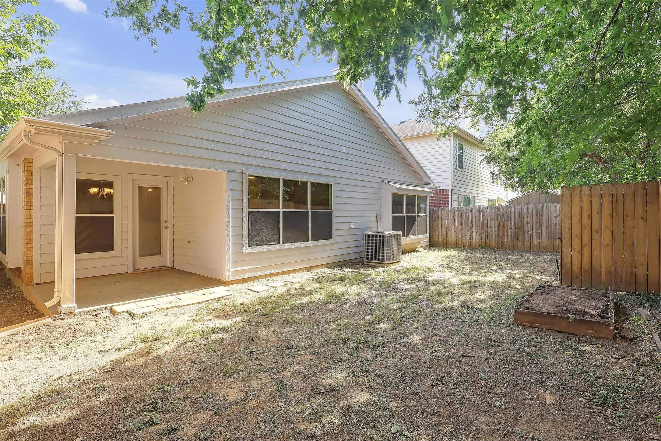 Rear view of property with a patio