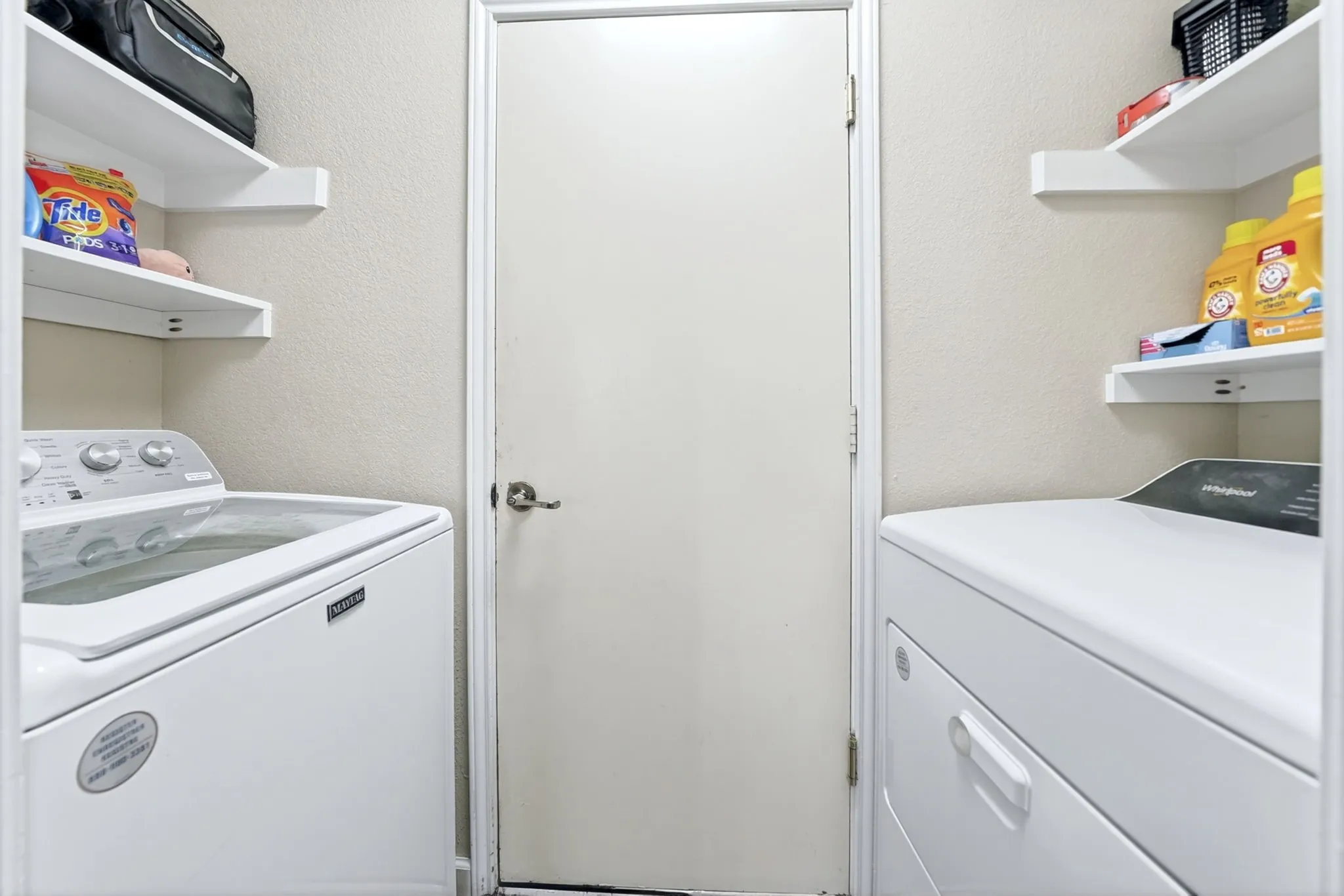 Dedicated laundry area featuring a washer and dryer