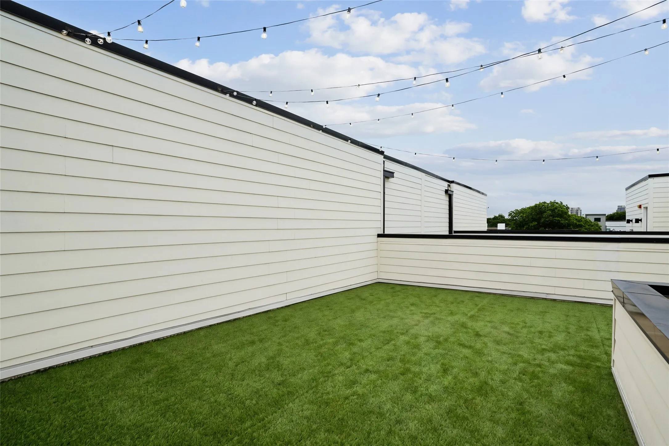 Roof top deck with turf virtually staged