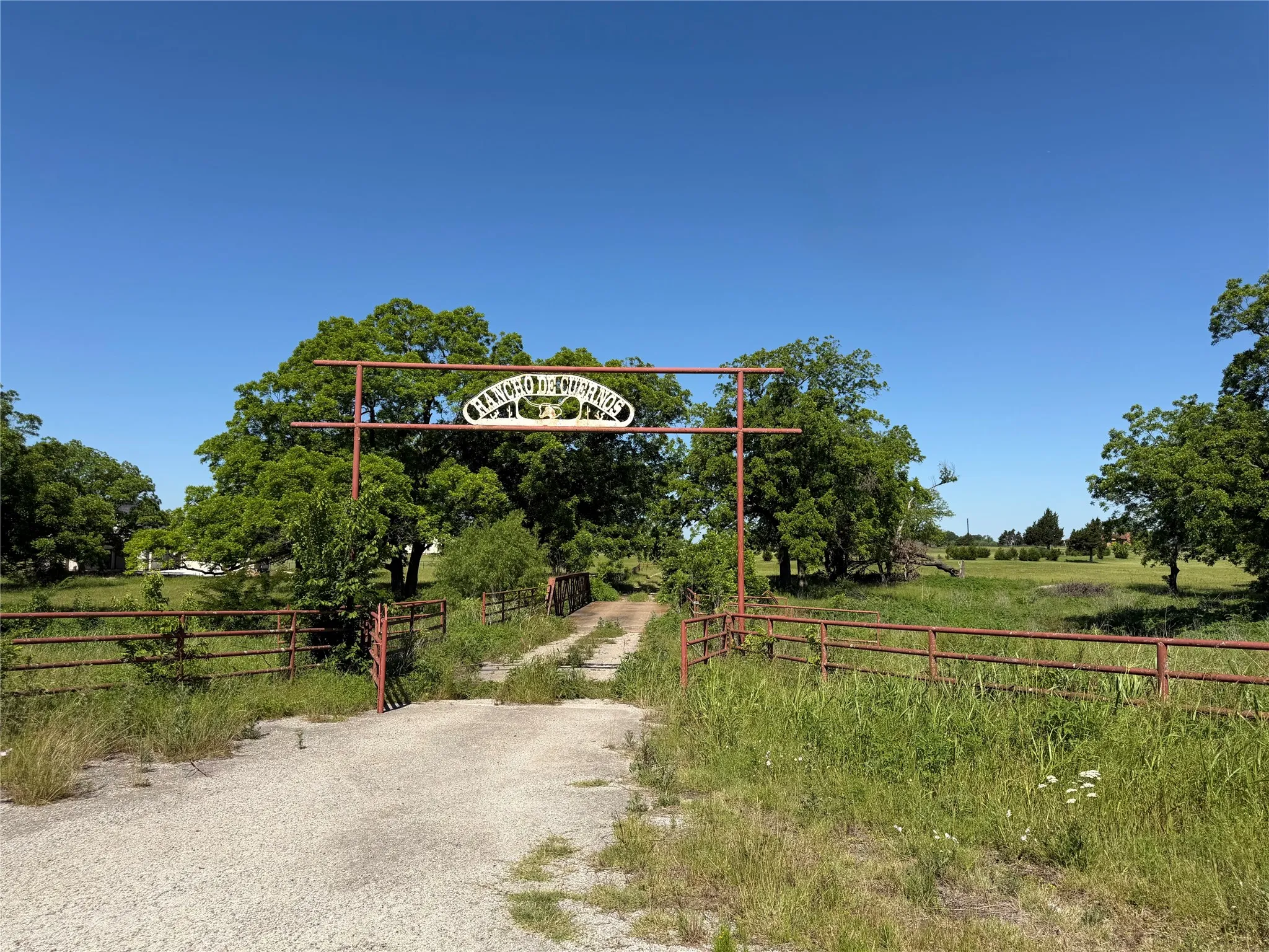Entry off of Business Highway 377 to be shared with property to the north of the bridge.