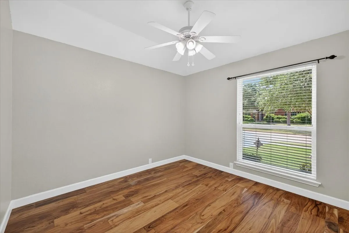 Neutral tone walls paired with wood-finish flooring