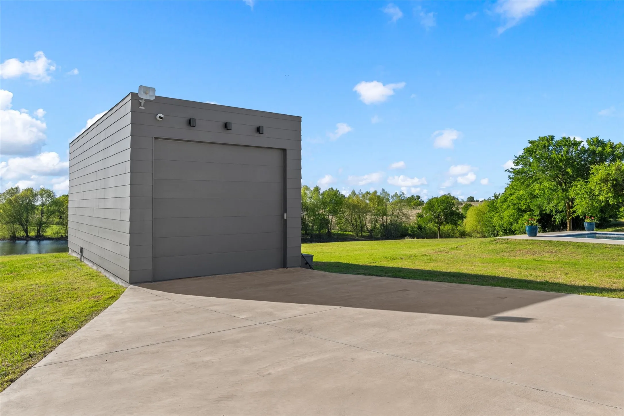 Detached structure with horizontal siding and a large garage door