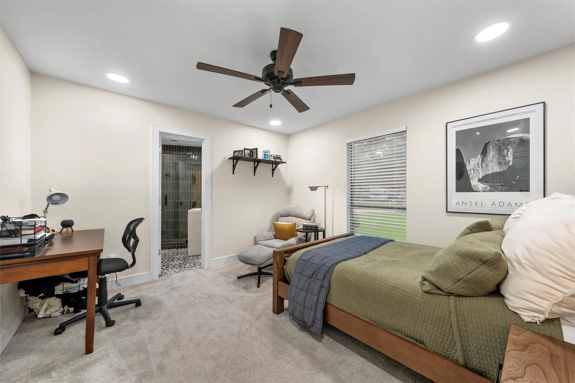 Carpeted room featuring recessed lighting, a ceiling fan with wood-finish blades, and a window with blinds