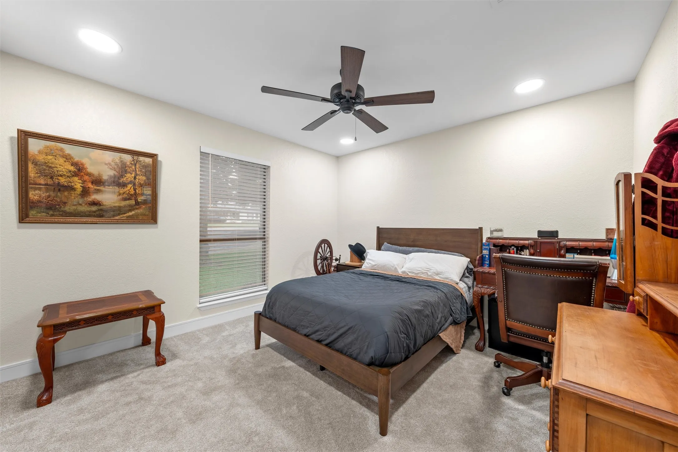 Carpeted bedroom with recessed lighting and a ceiling fan