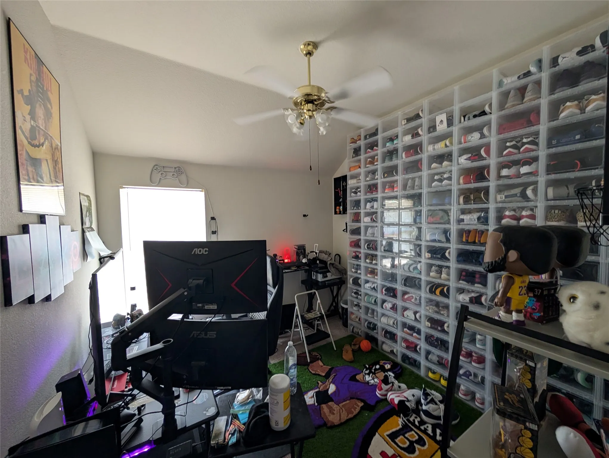 Room featuring vaulted ceilings and a ceiling fan with integrated lighting