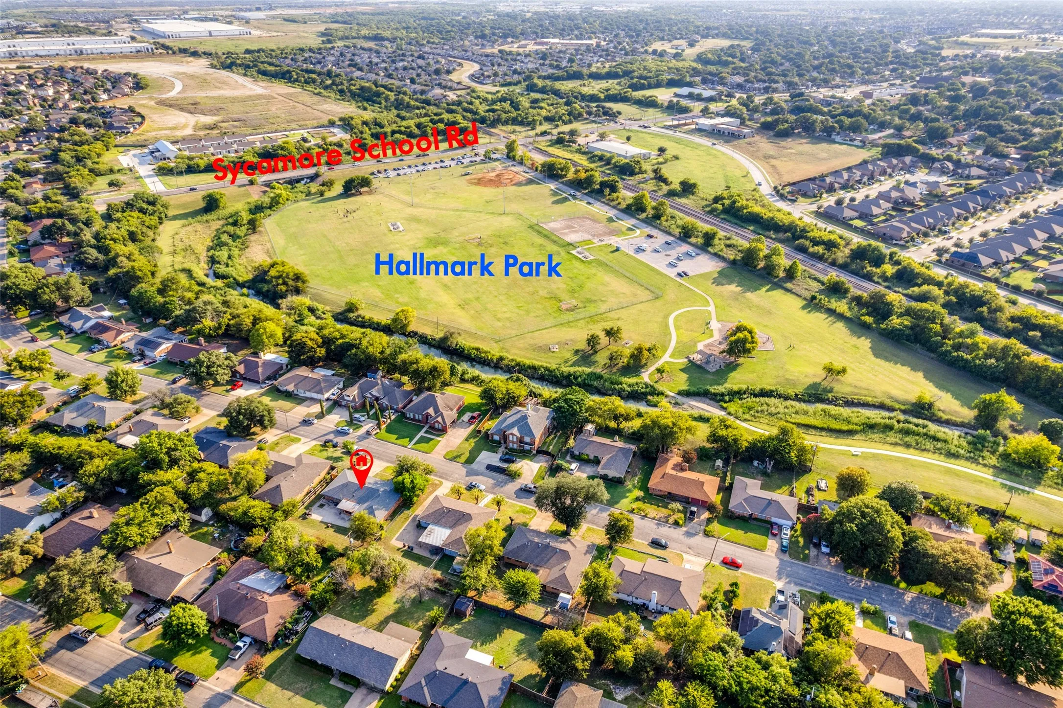 Aerial overview showcasing residential properties and extensive green spaces