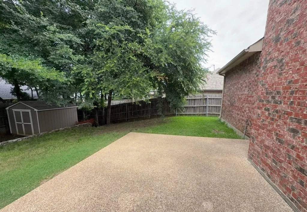Expansive outdoor patio with a textured aggregate surface