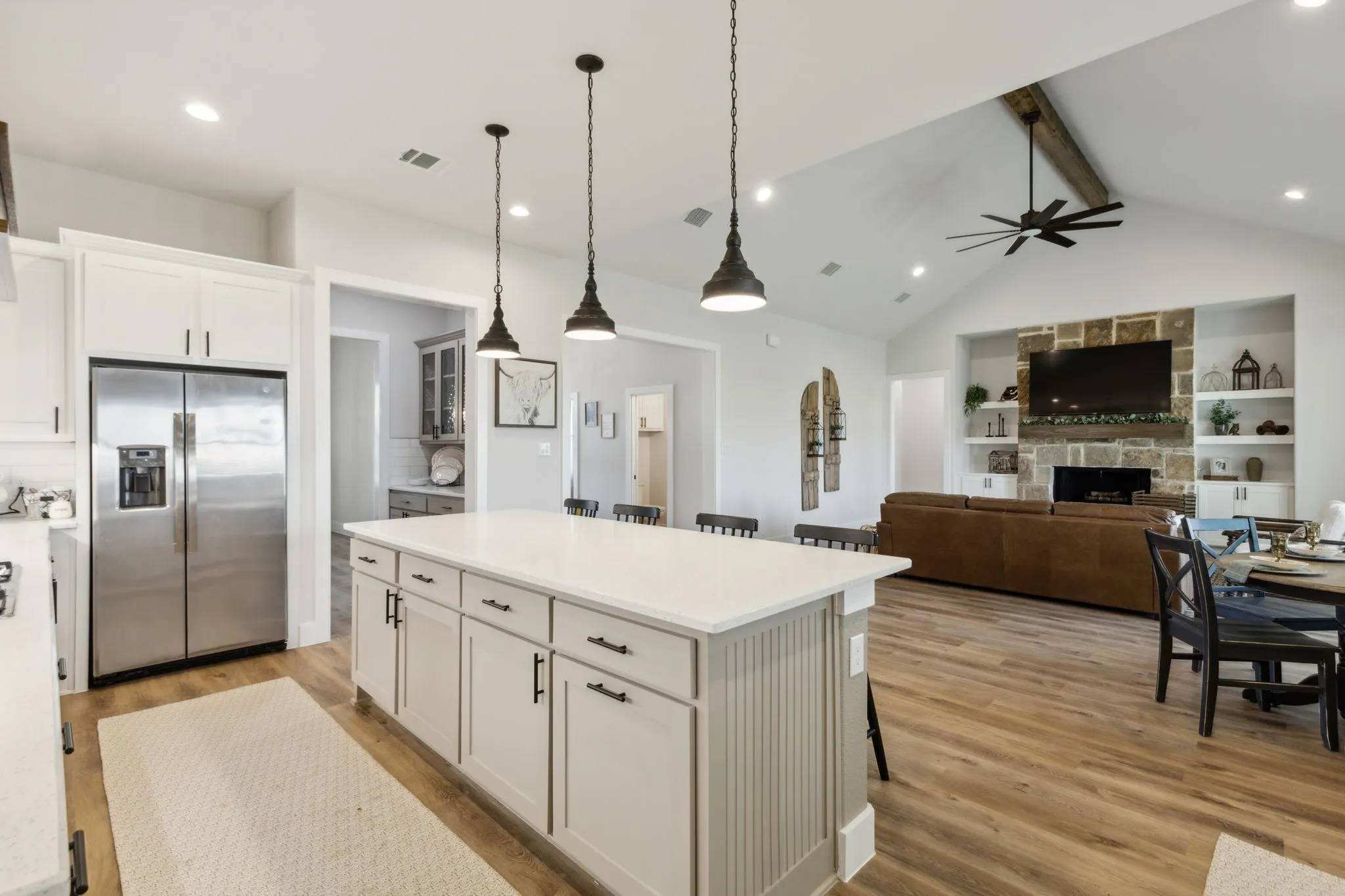 Kitchen island with white countertop and pendant lighting