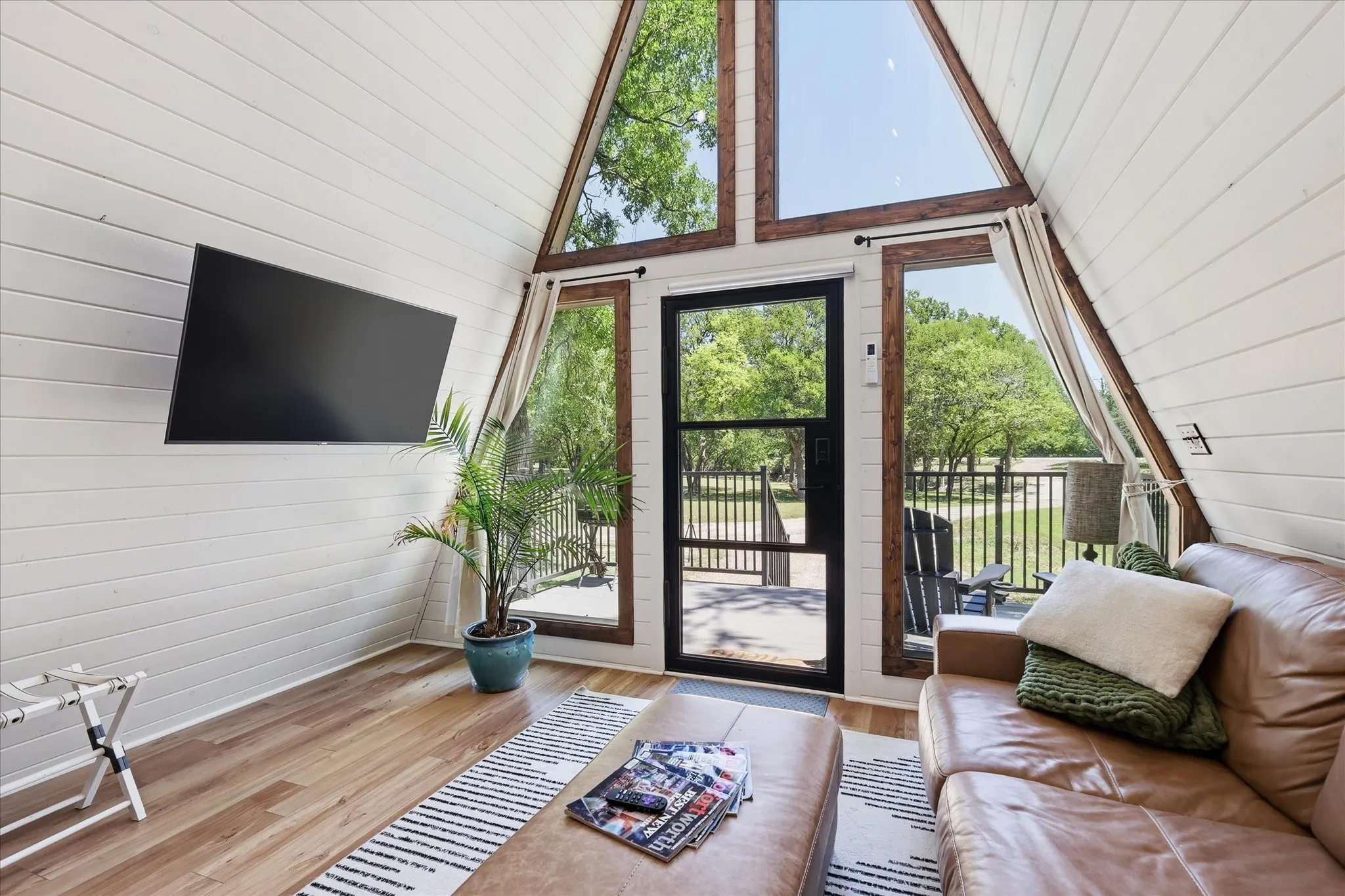 Tiny Cabin Living Room with Amazing Wall of Windows.