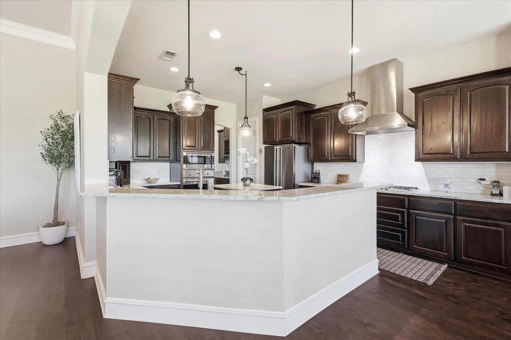 Large Kitchen with Updated Lighting, Viking Appliances, and Granite Countertops.
