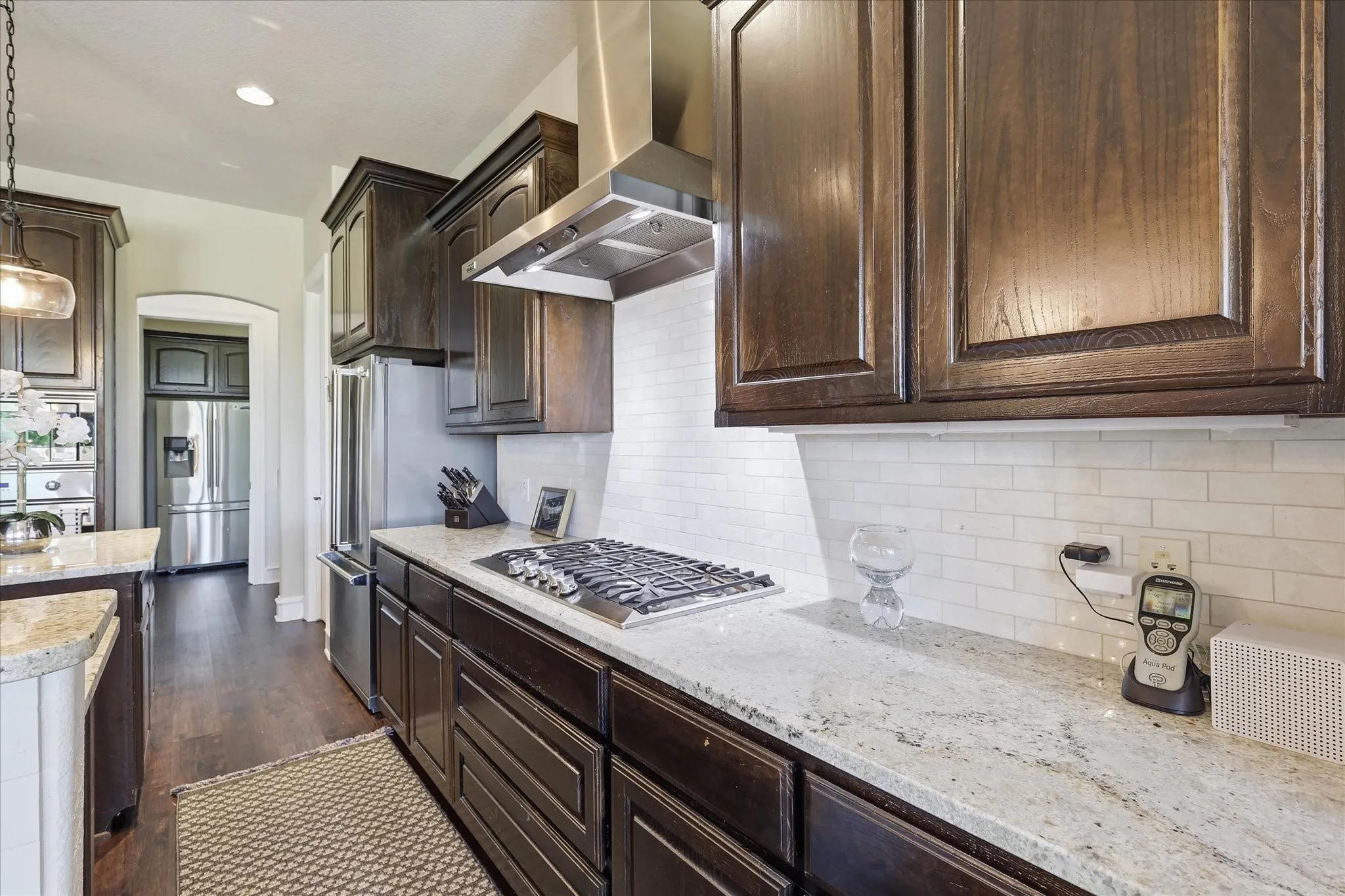 Large Kitchen with Updated Lighting, Viking Appliances, and Granite Countertops.