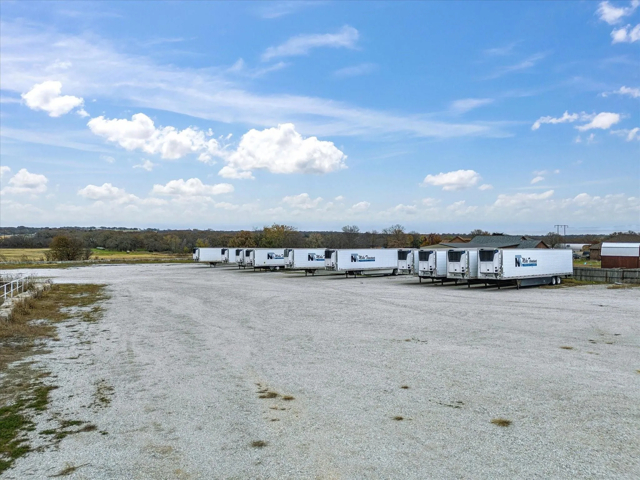 Expansive gravel lot offering extensive outdoor storage