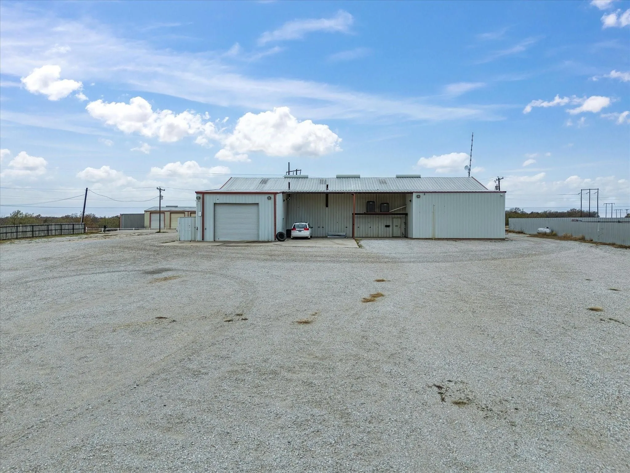 Industrial-style building featuring a metal roof and corrugated metal siding