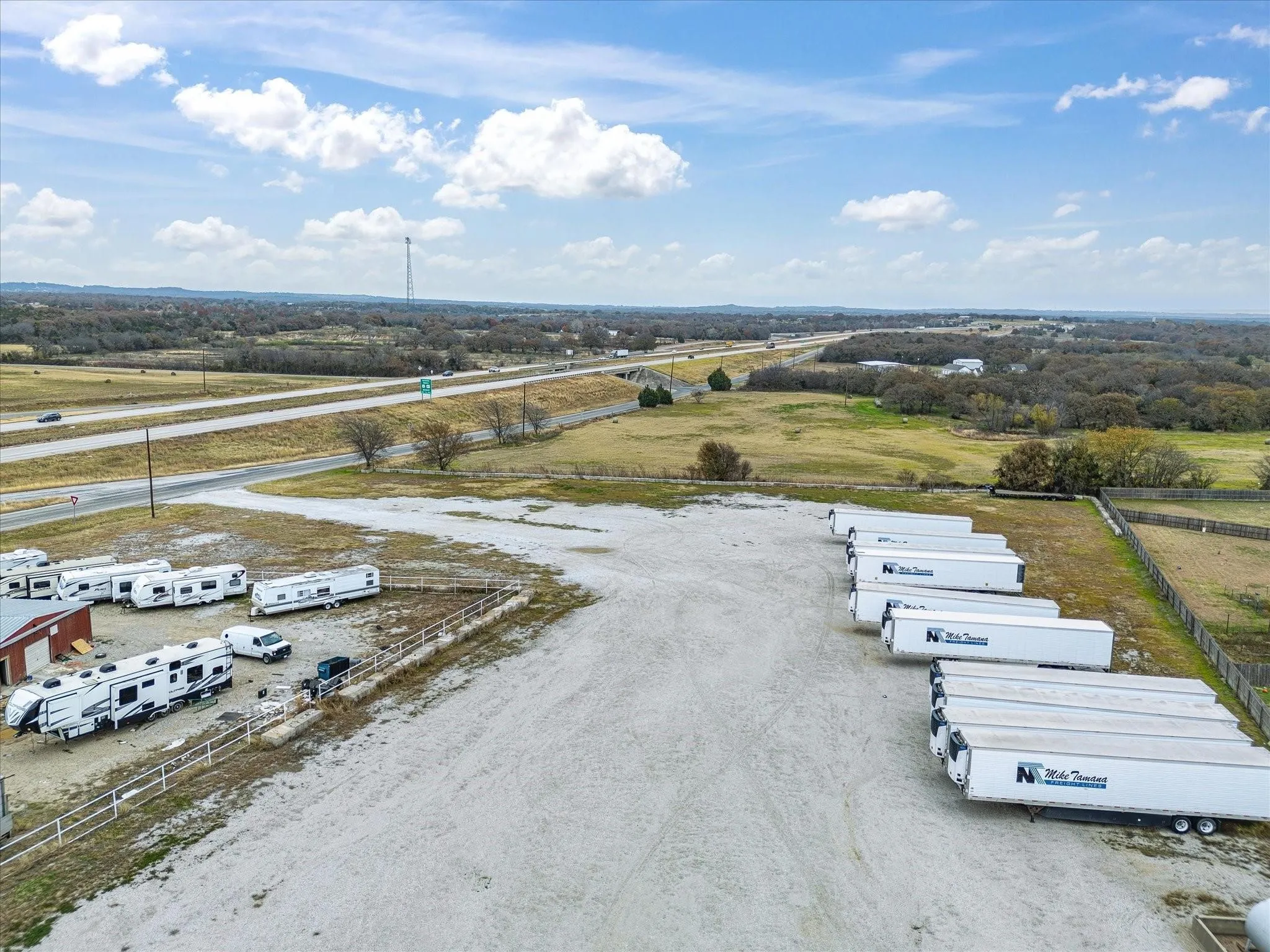 Expansive gravel lot with highway frontage