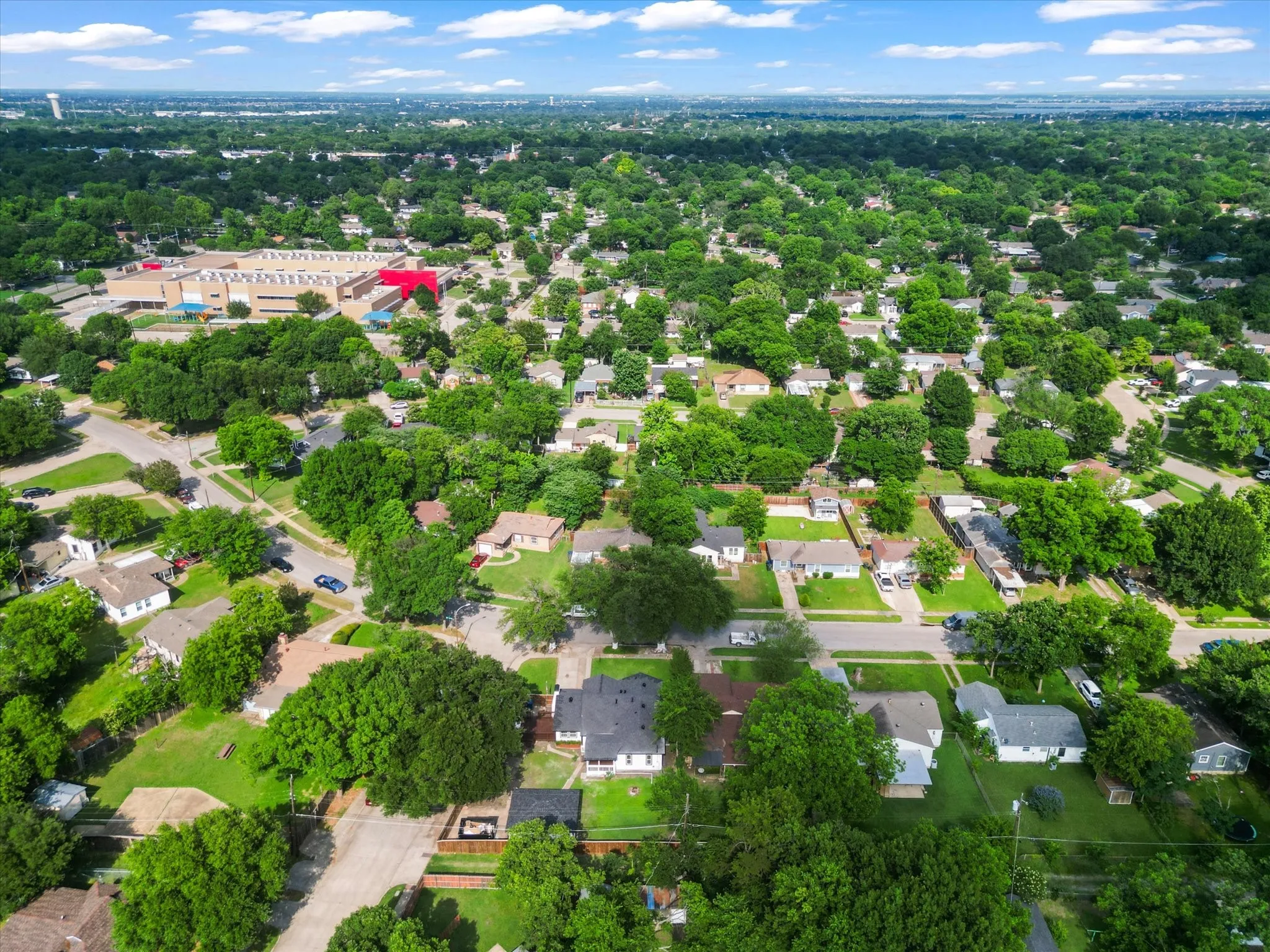 Aerial perspective of a residential area featuring numerous detached properties