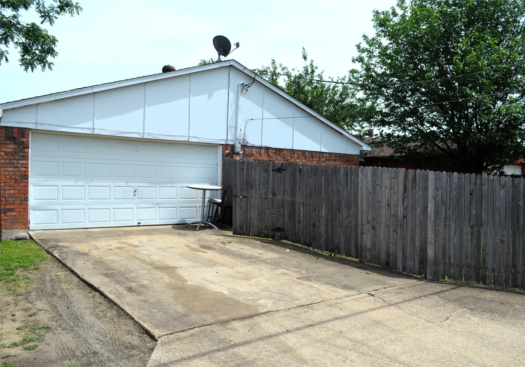 Attached garage with a panel-style door