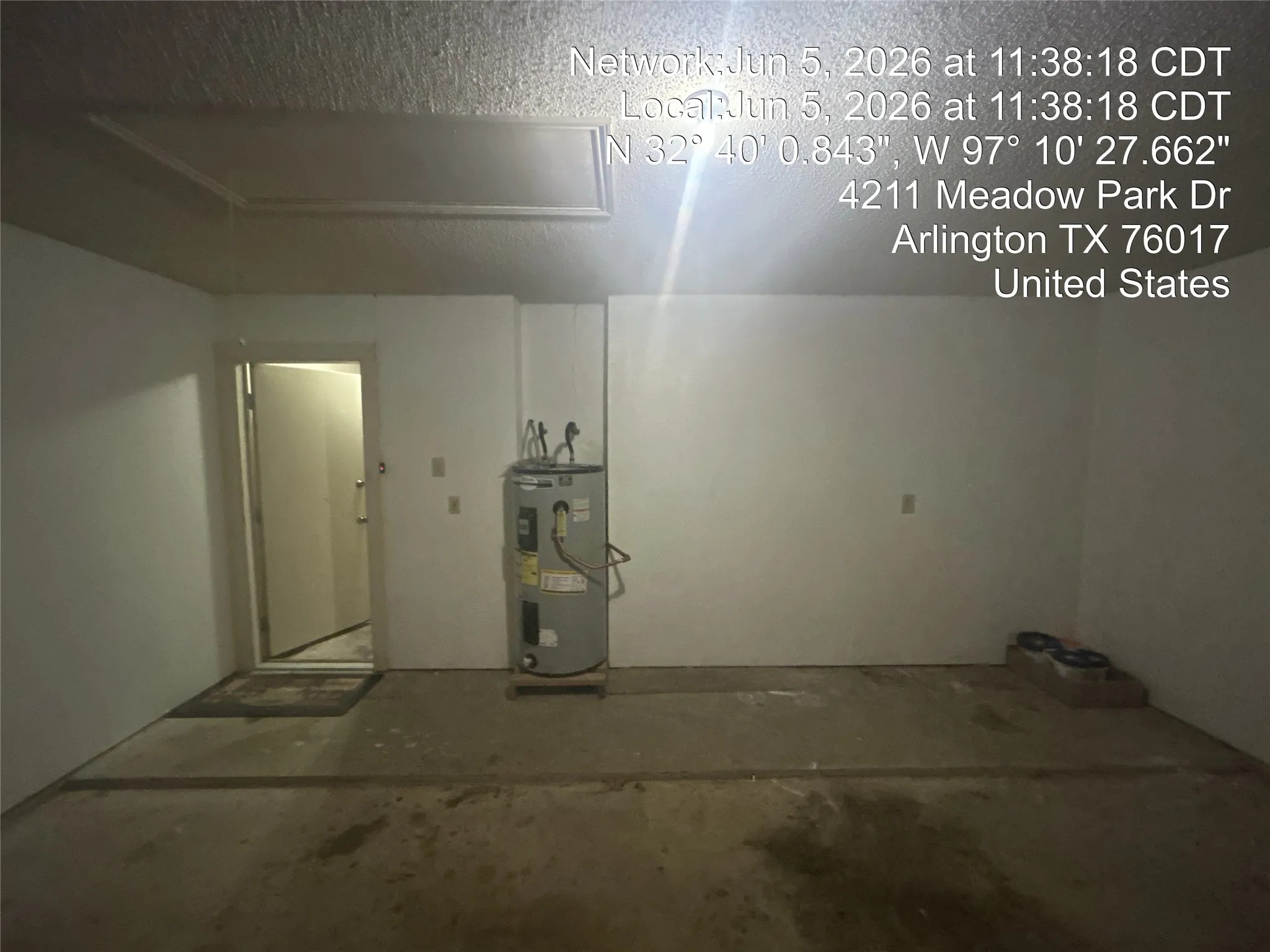 Concrete flooring, white painted walls,