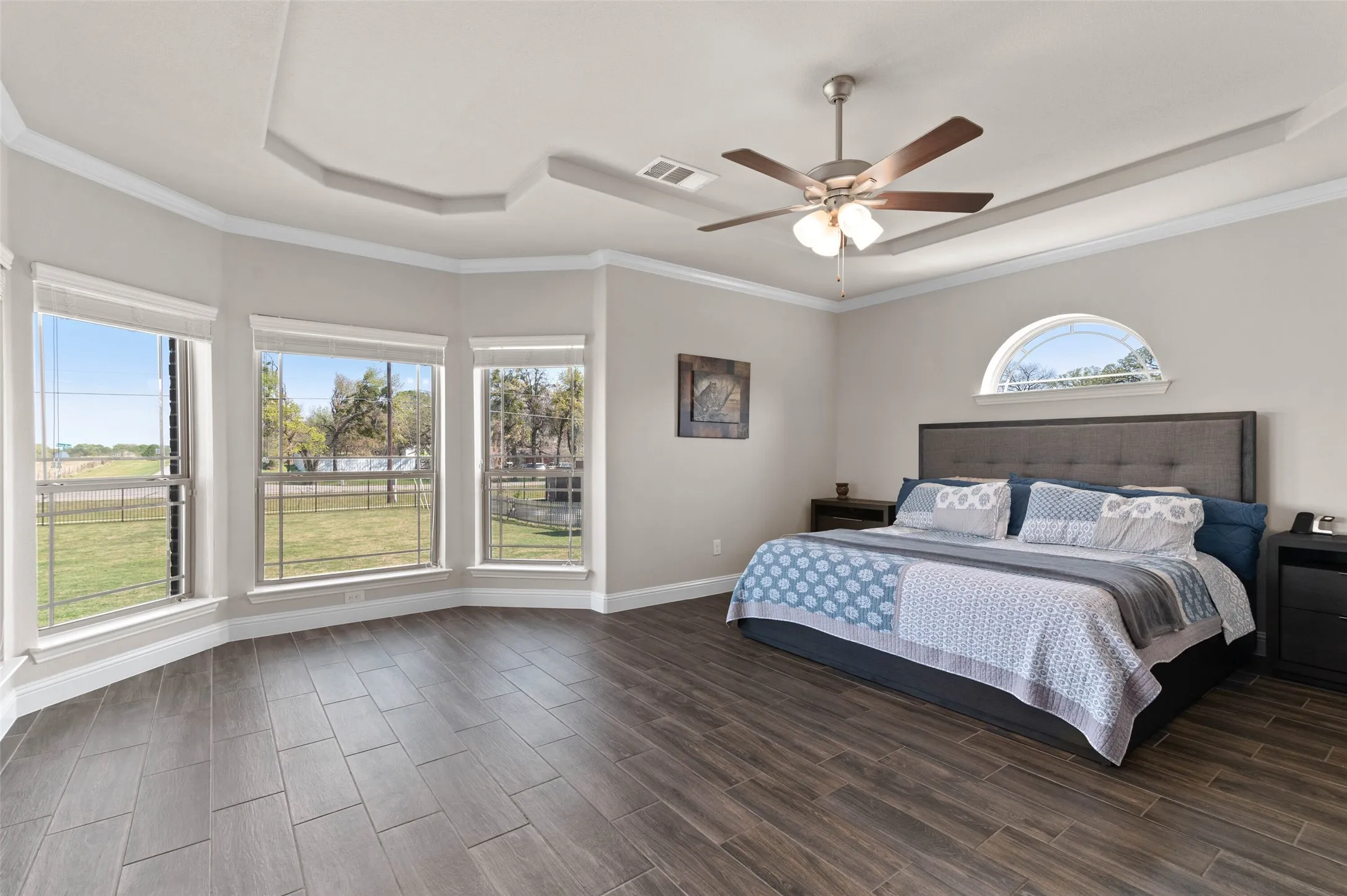 Primary Bedroom Suite with Ensuite Primary Bath, Lots of light, Ceiling Fan and beautiful floors!