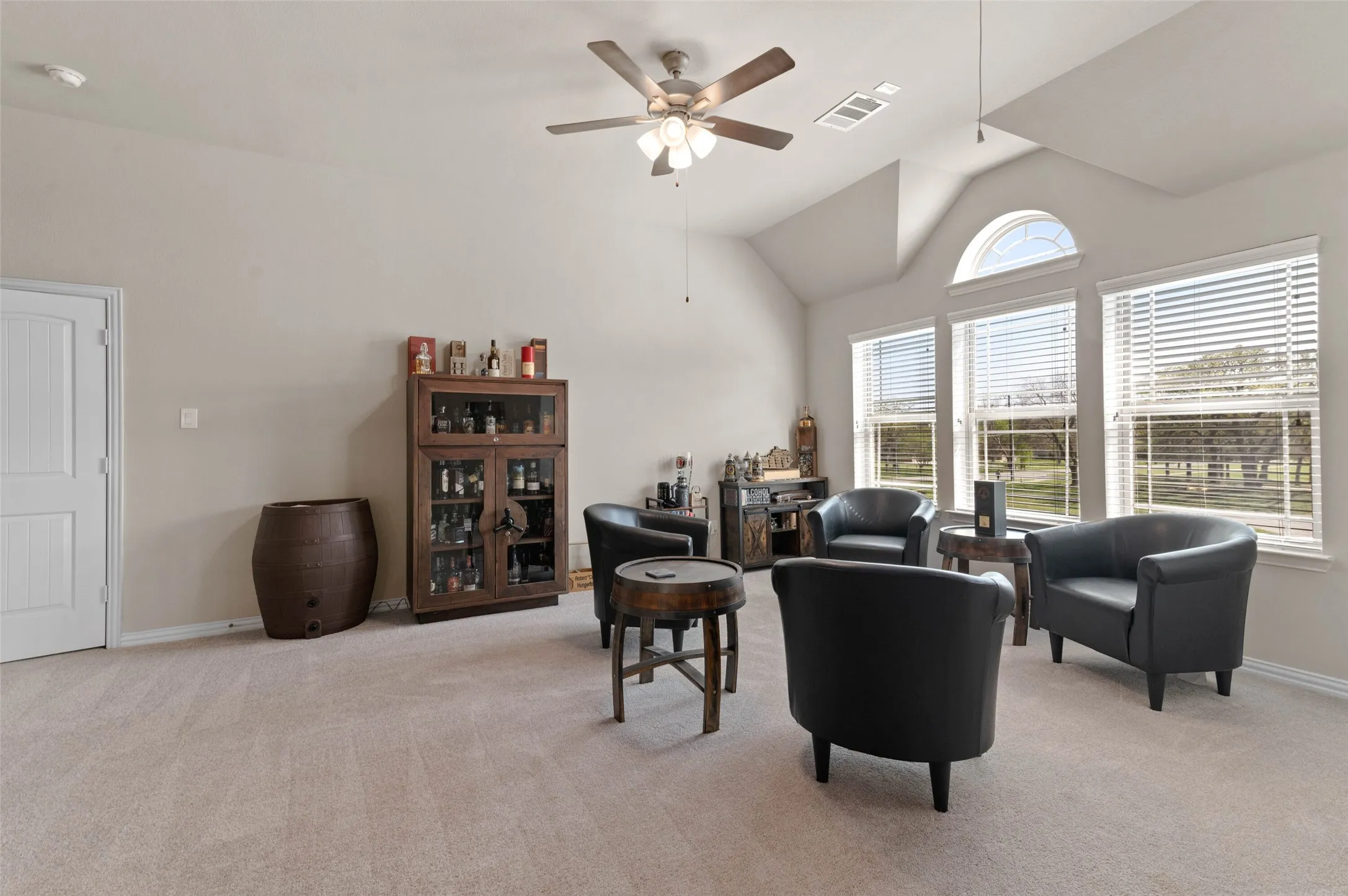 Game room with vaulted ceilings and a ceiling fan
