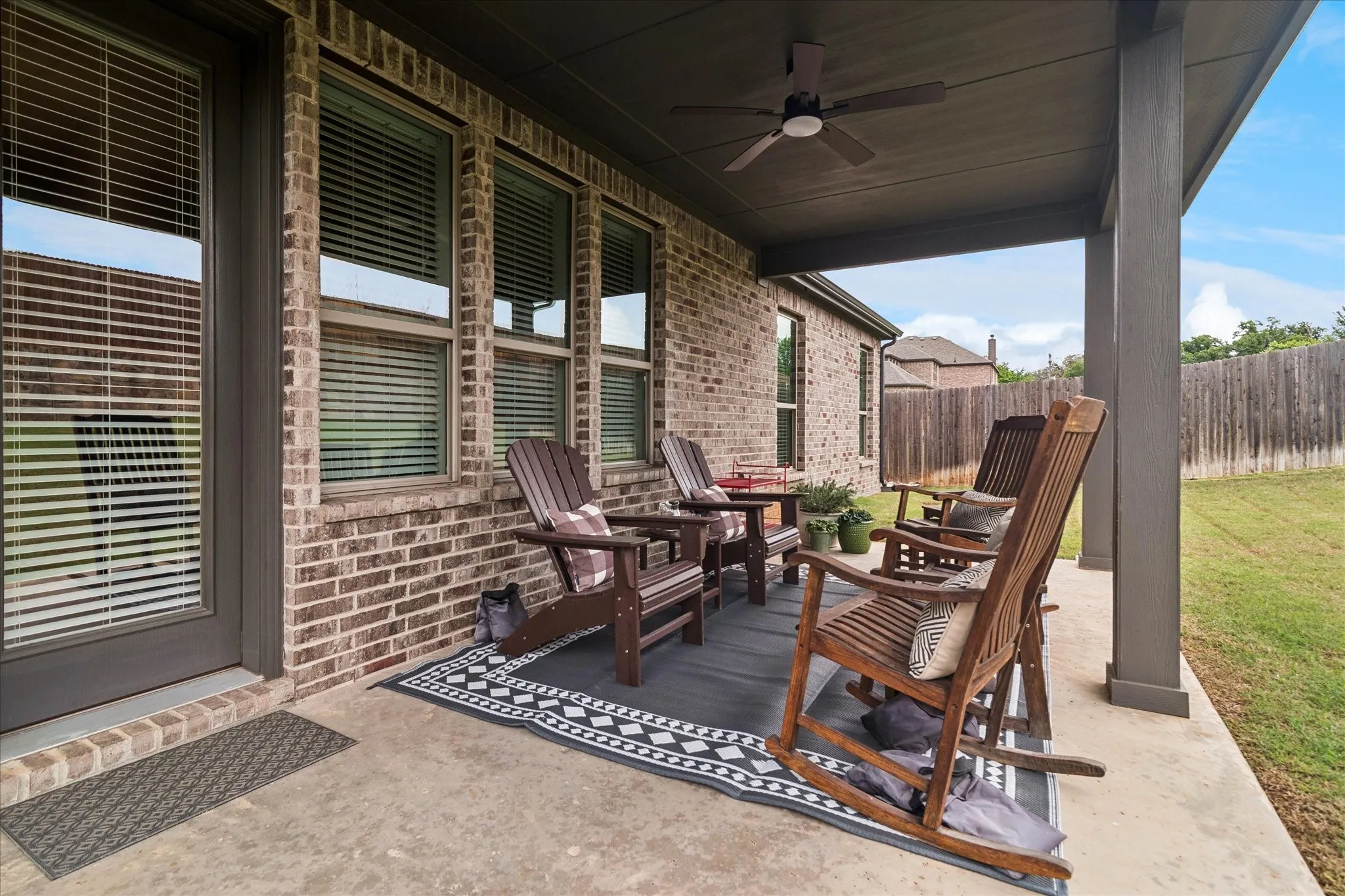 Covered patio featuring a ceiling fan