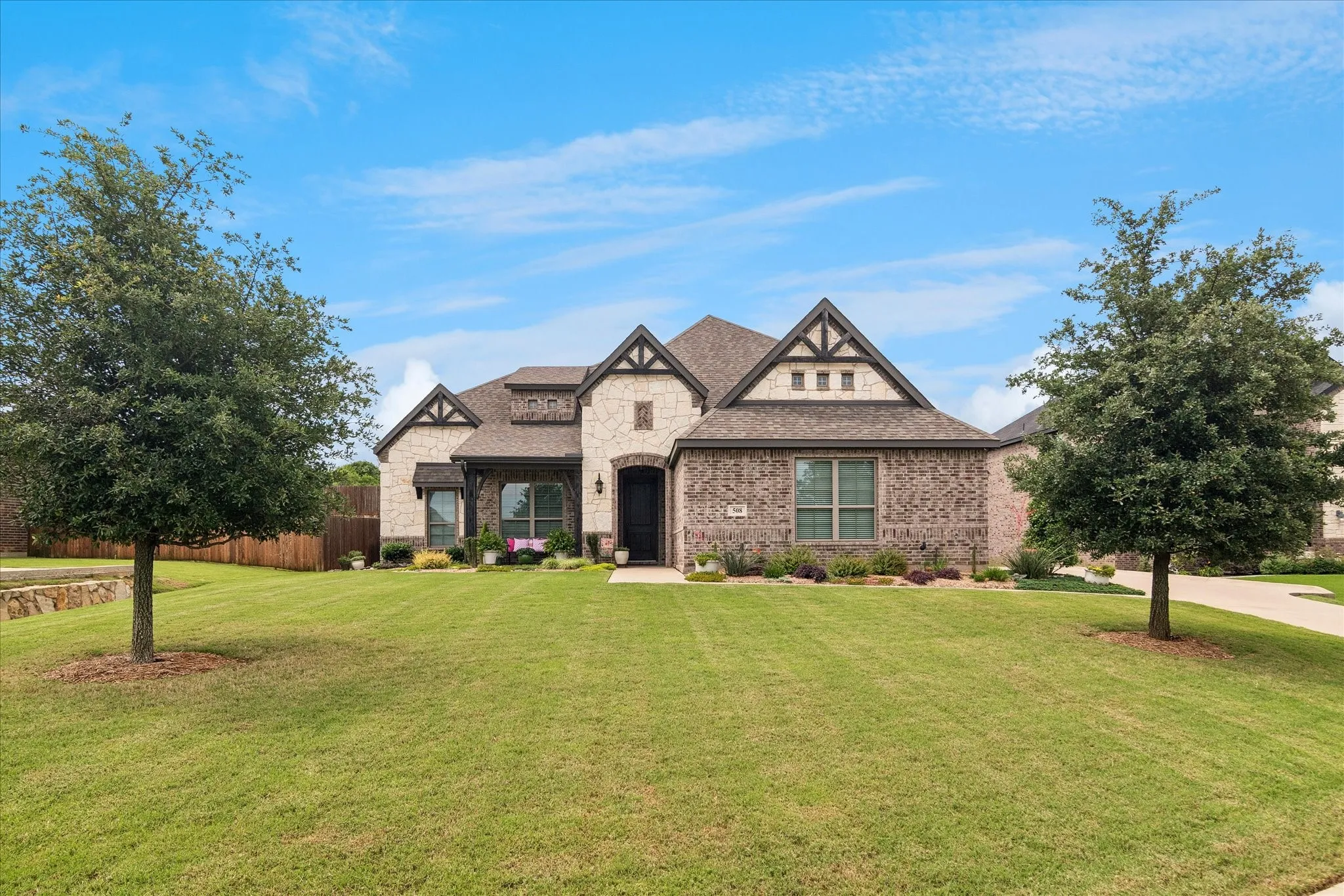 Stone and brick facade with dark trim accents