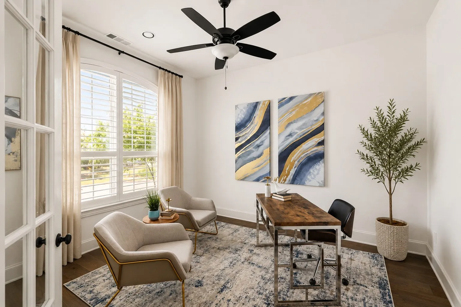 Dedicated room featuring a large arched window with plantation shutters, wood-finish flooring, and a ceiling fan with integrated lighting
