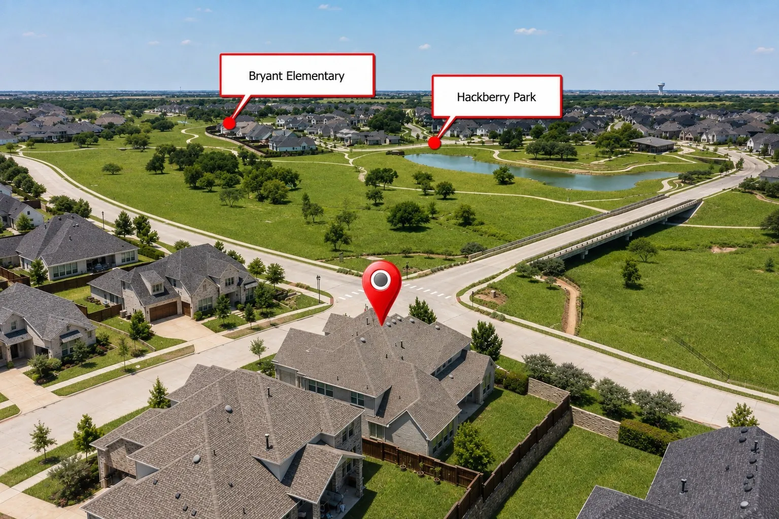 Aerial perspective of a residential neighborhood featuring established homes, green spaces, and a nearby pond