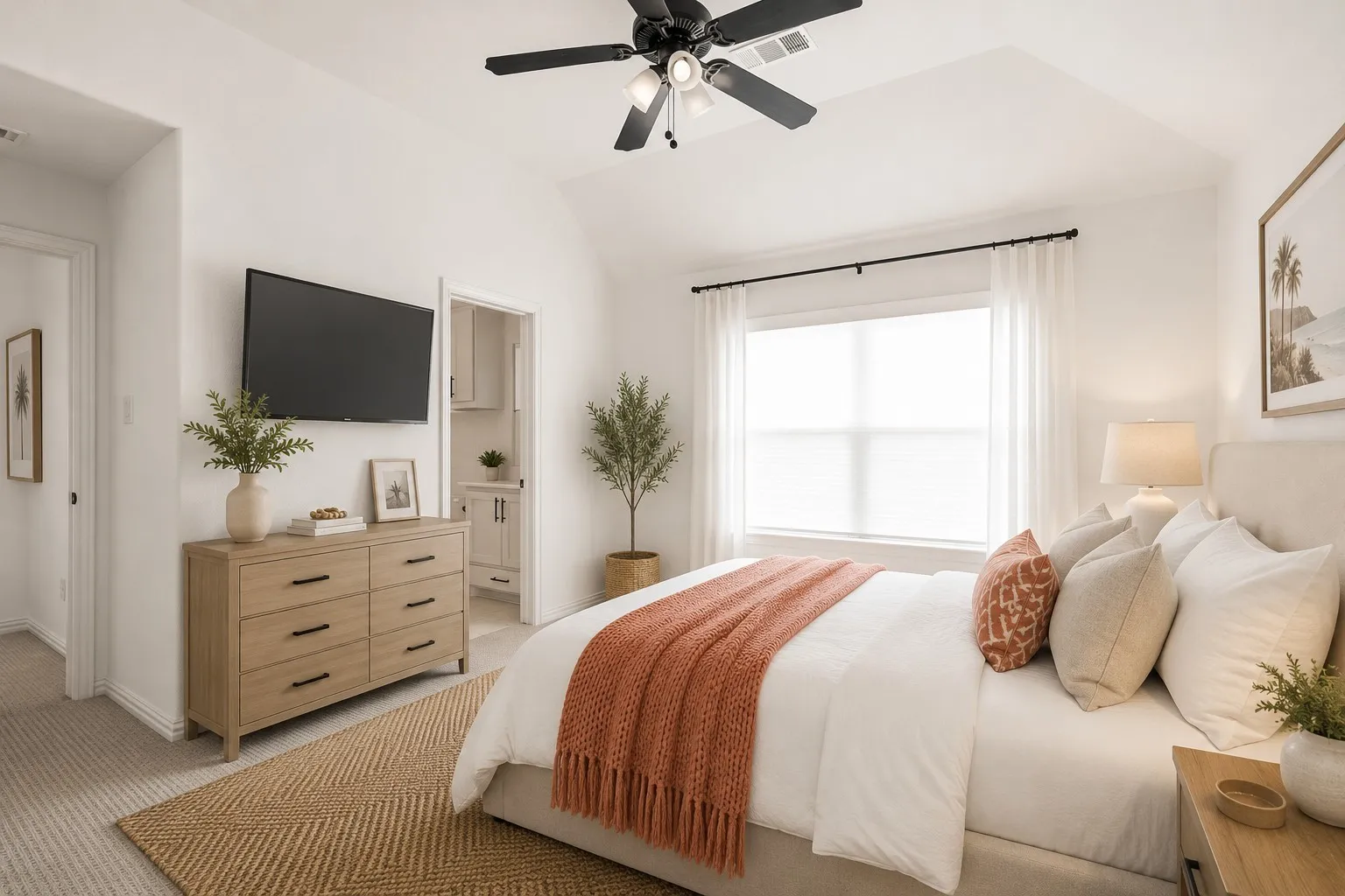 Vaulted ceiling with a black ceiling fan, large window with white blinds and curtains, wall-mounted television, and a doorway revealing built-in cabinetry