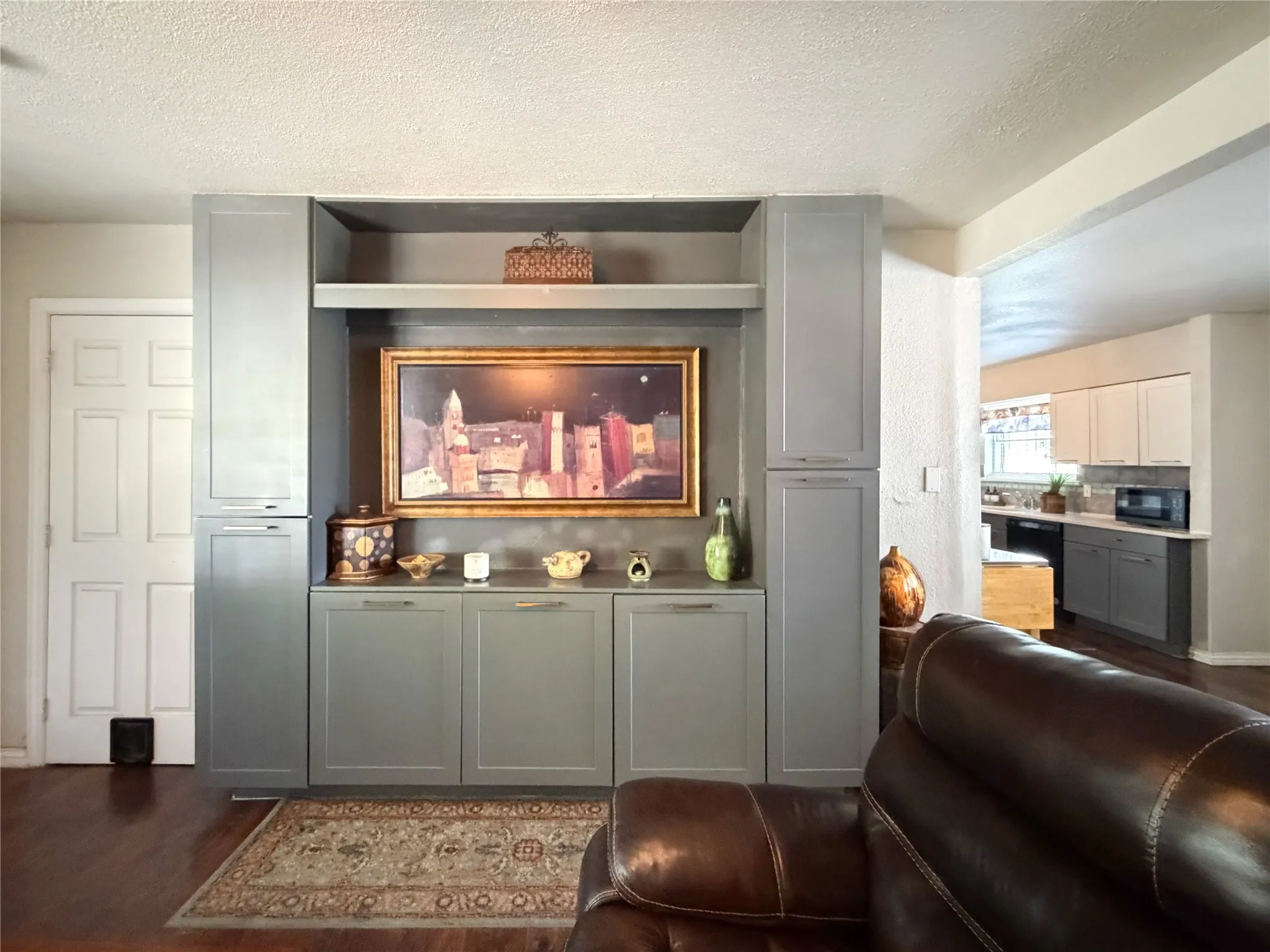 Custom built-in cabinets are the perfect place for art or flat screen.