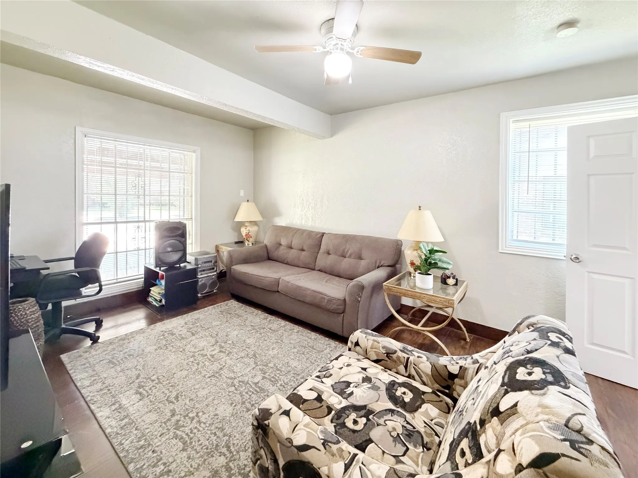 Secondary living area is tucked away and would make a great game room space.
