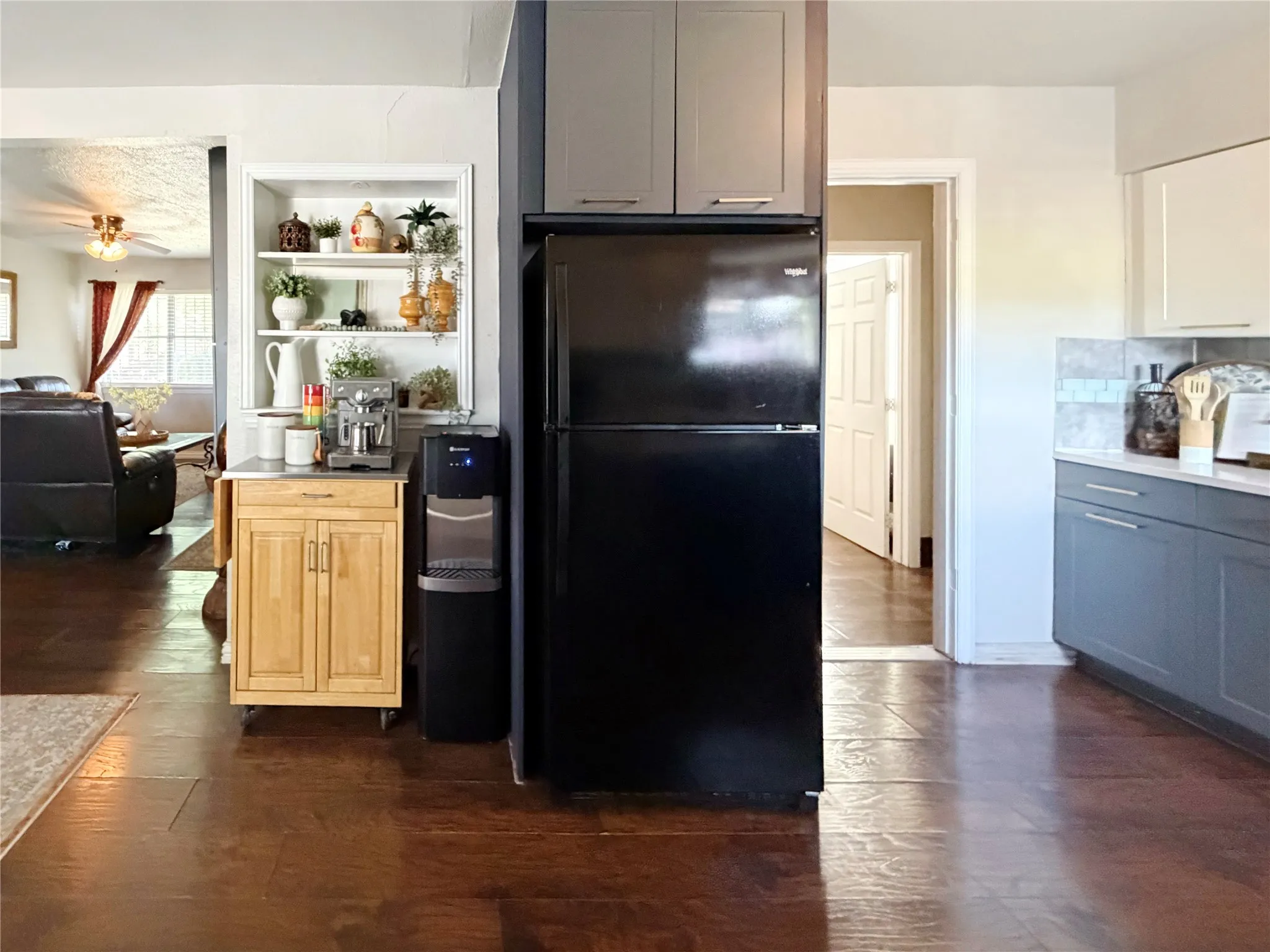 Built-in shelving offers a great space for a coffee bar area.
