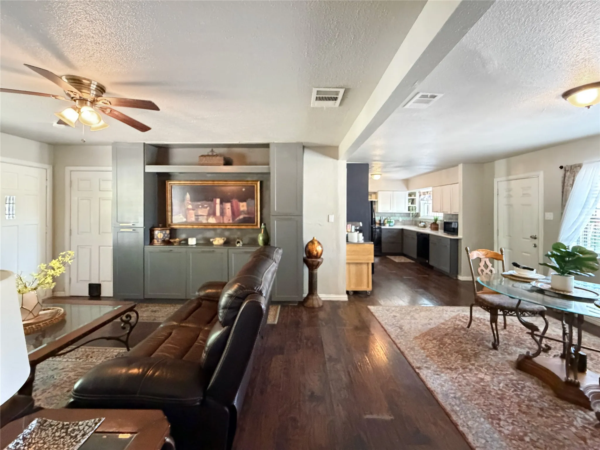 The living room leads to the additional bedrooms.