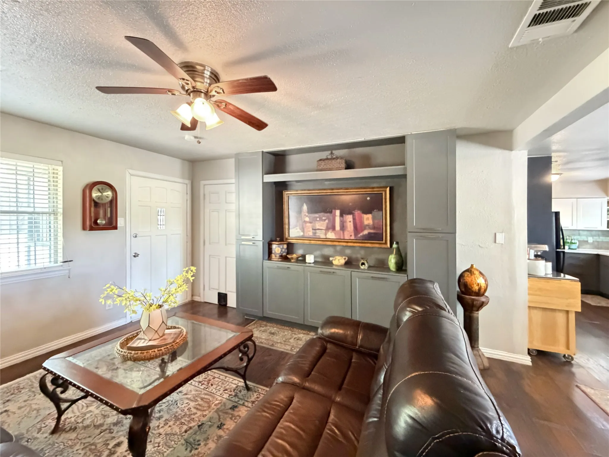 The inviting living area featuring custom built-ins.