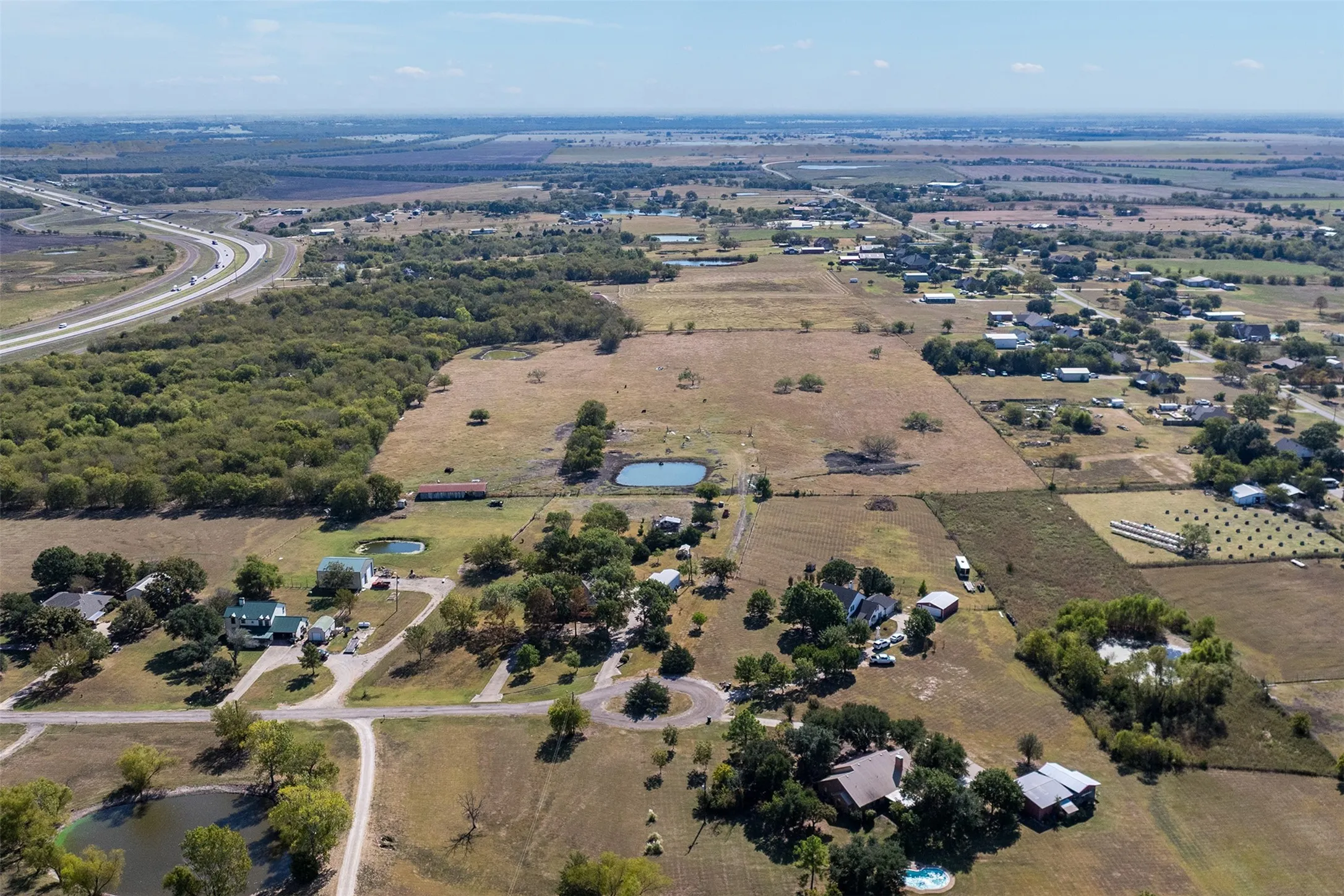 Aerial view of property's location with rural landscape