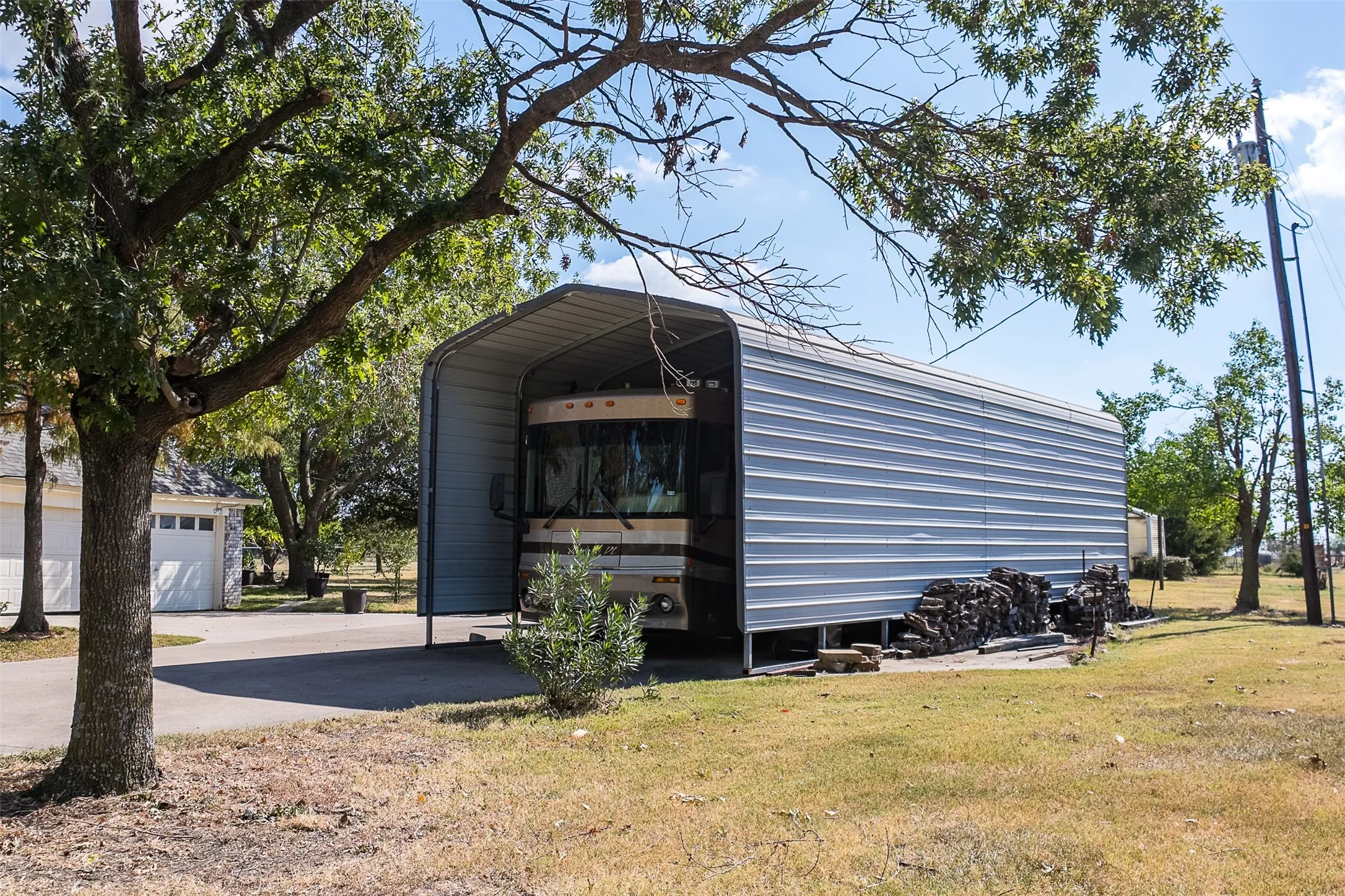 View of outdoor structure with a carport