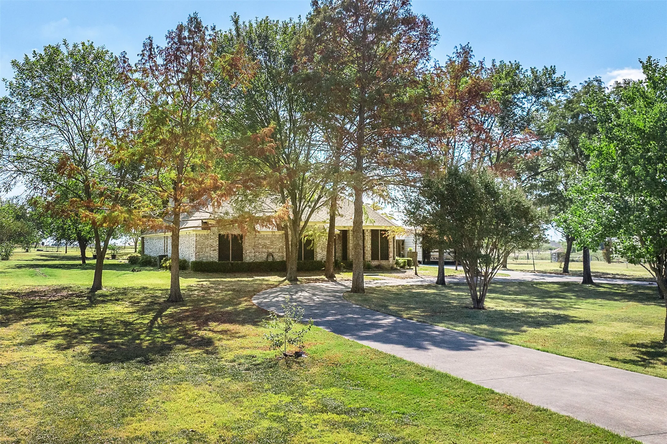 View of property's community with a lawn