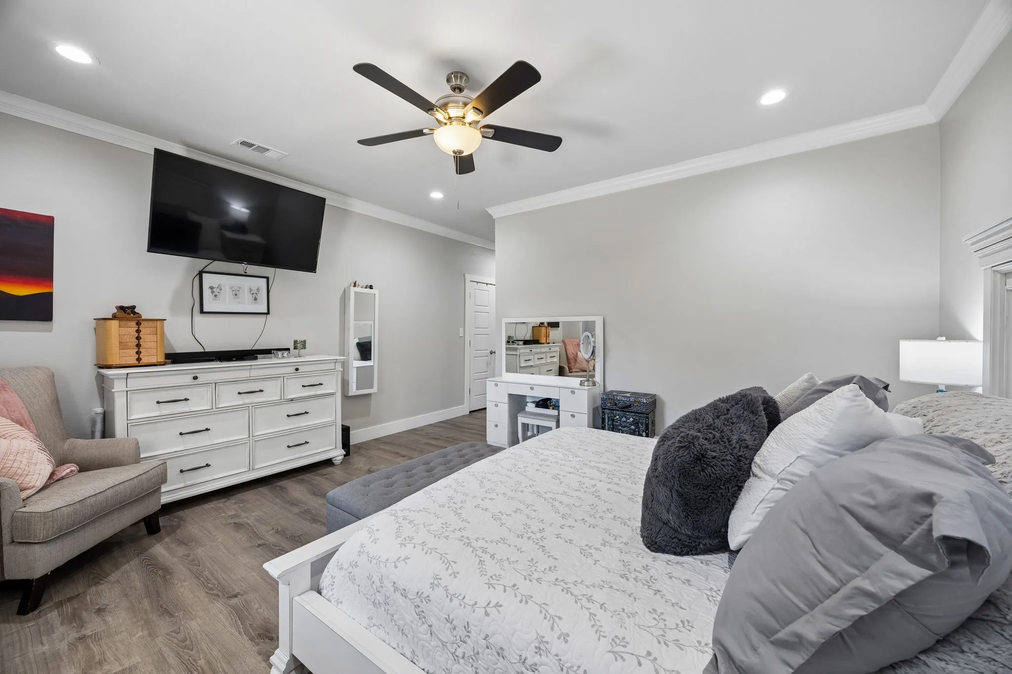 Primary Bedroom featuring wood-finish flooring, recessed lighting, and a ceiling fan with light fixture